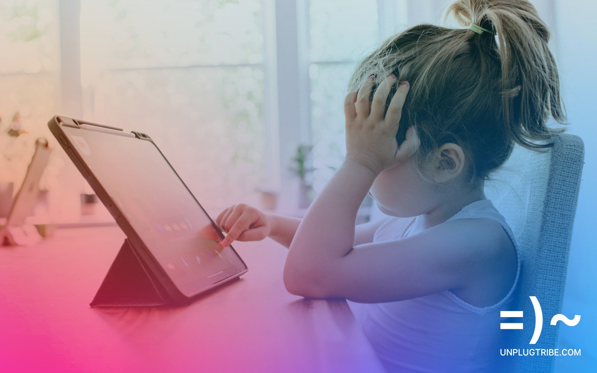 A little girl tapping the screen of an iPad resting her head on her other hand